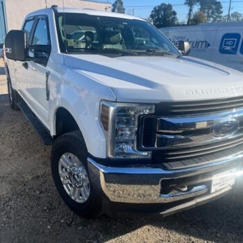 White truck in repair shop