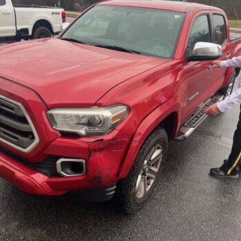 Red truck front-end collision damage